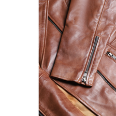 Women's distressed biker leather jacket with piping