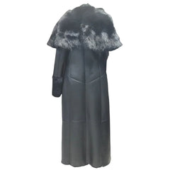 Back view of the Aria oversized leather sheepskin coat, showcasing the relaxed fit and premium long-line silhouette for winter layering.