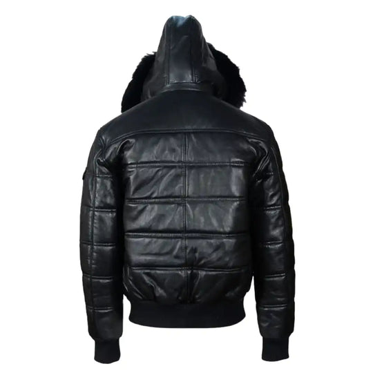 Back view of the Ash leather puffer showing the wide horizontal quilted baffles and the clean hang of the leather-clad hood.