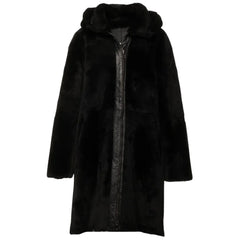 Outside view of the Avalon Black oversized reversible sheepskin long coat, showing the luxurious shearling lining for added warmth and comfort.