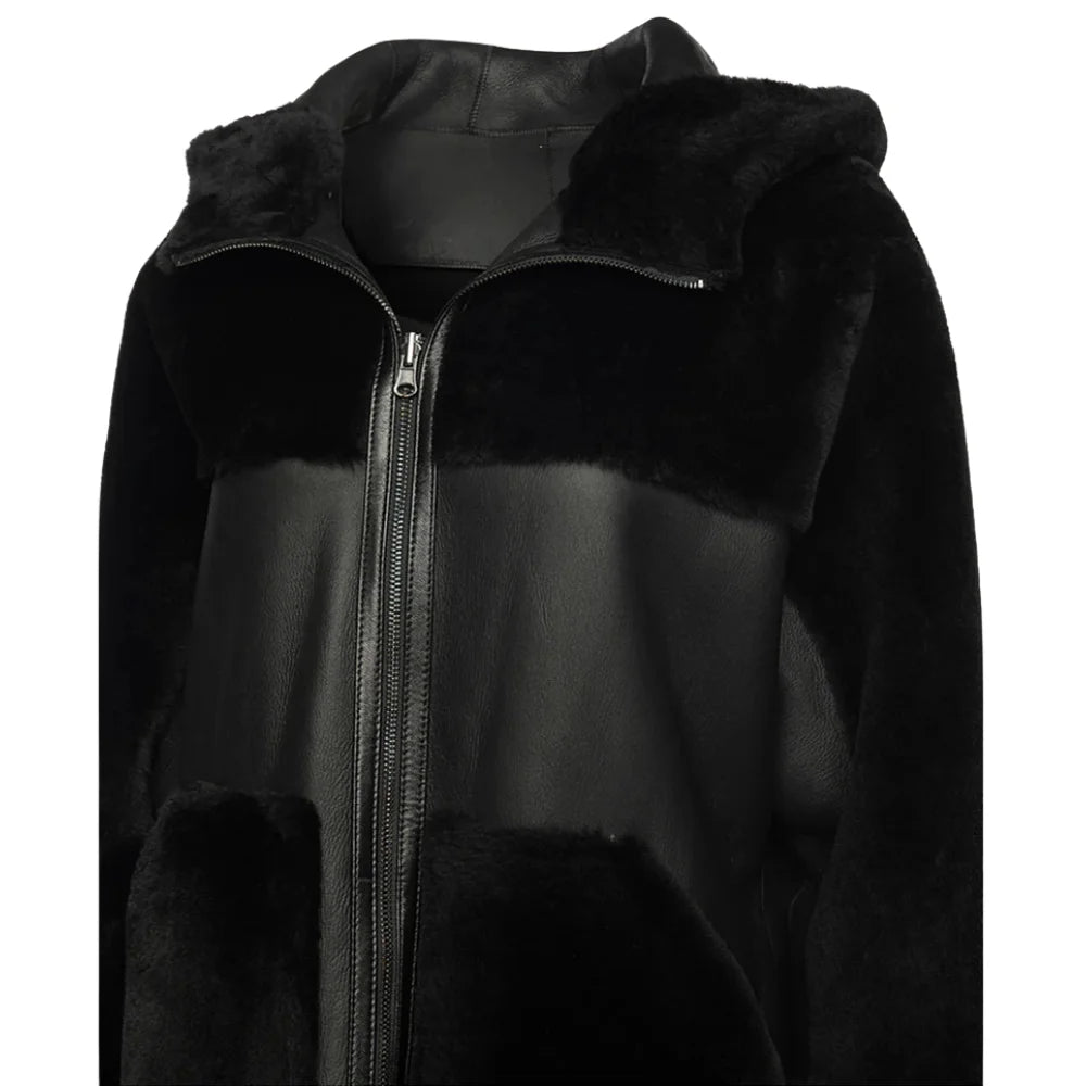 Front view of the Elena oversized jacket showing the smooth black leather exterior with plush shearling trim on the collar and cuffs.