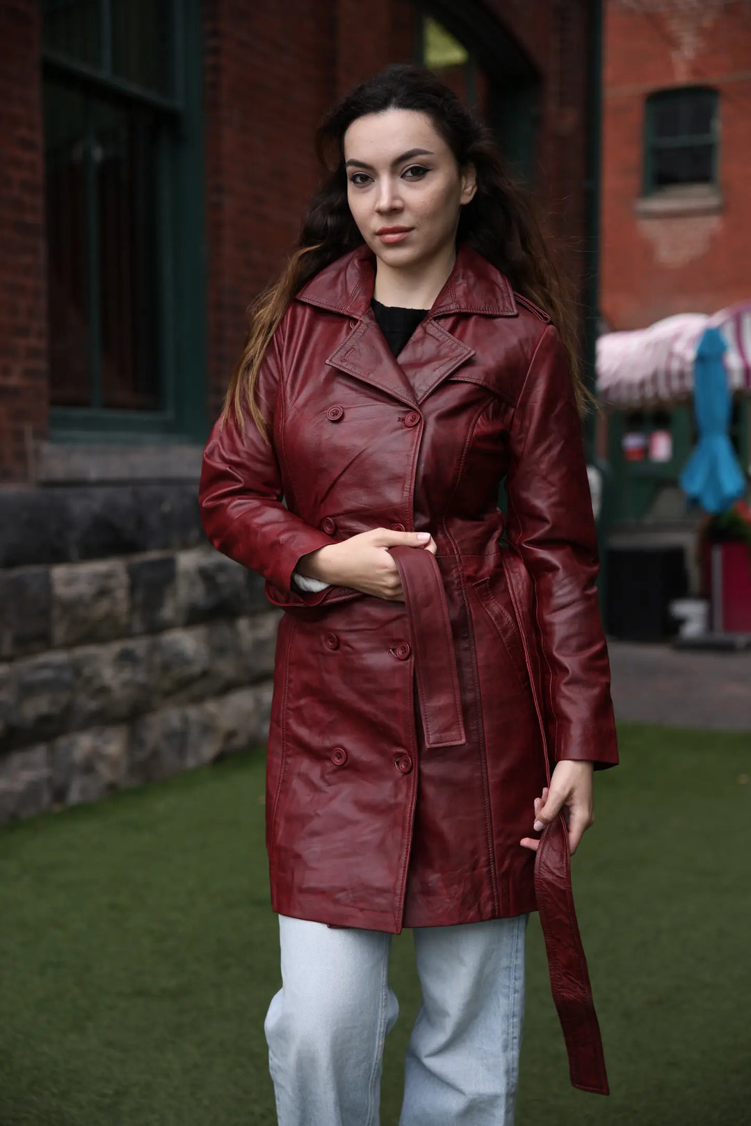 Coral red belted leather coat