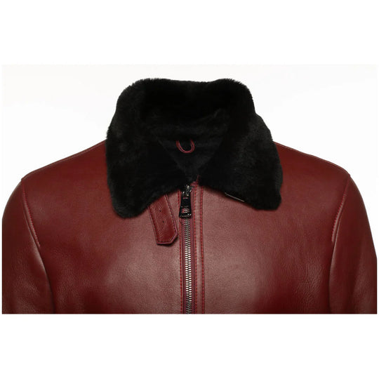 Close-up of the front view of the Aurelius Burgundy B3 Bomber Jacket featuring plush black shearling lining on a white background.