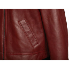 Detailed shot of the slanted waist pocket and textured leather finish of the Aurelius Burgundy B3 Bomber on a white background.