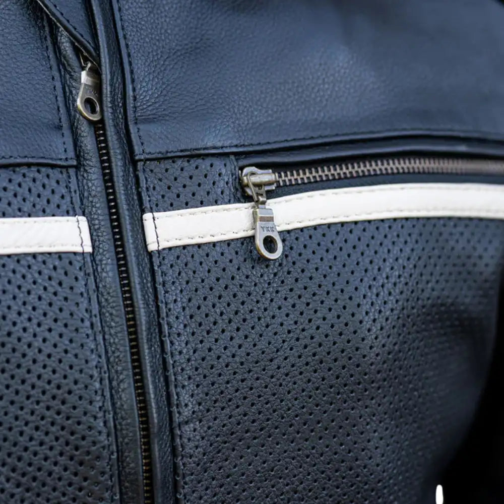 Close-up of the mandarin-style snap collar and heavy-duty main zipper on smooth, premium black leather.
