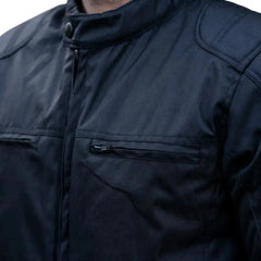 Close-up of the waterproof-treated leather grain and heat-sealed zippers designed to block moisture entry.