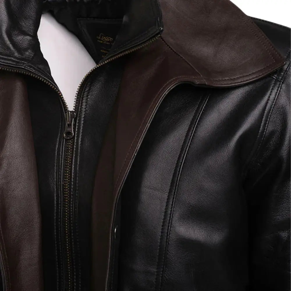 Close-up of the Byrnes aviator jacket featuring a contrast brown spread collar against a black leather body.
