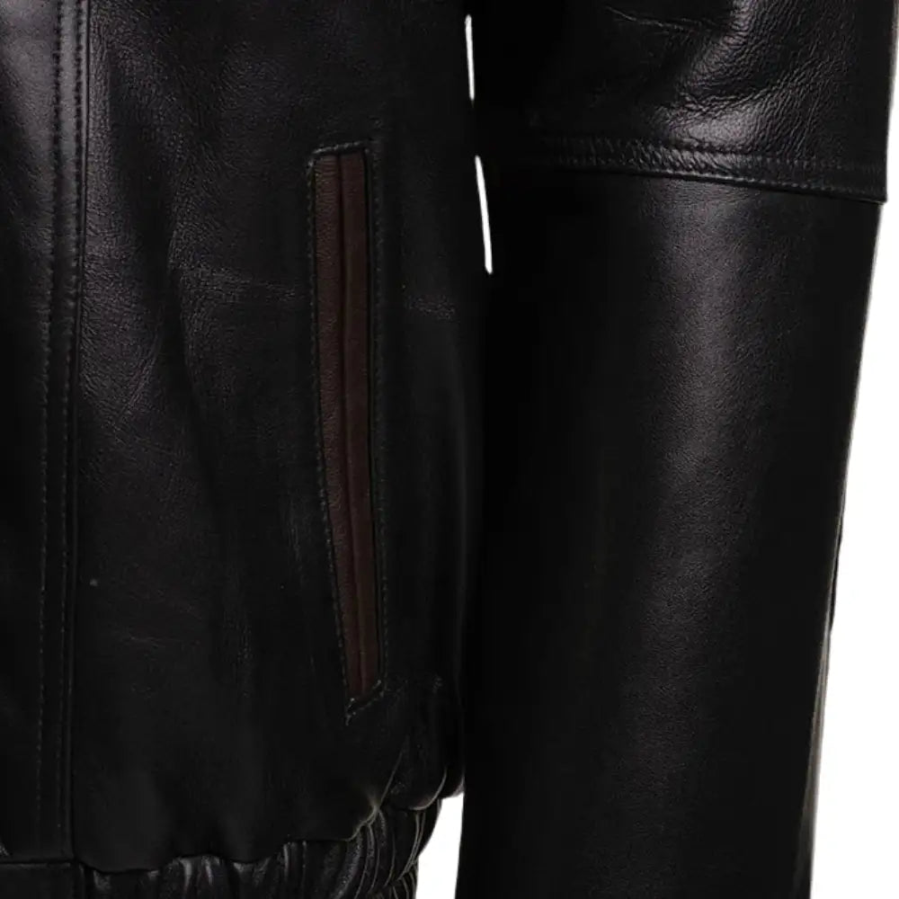 Detailed view of the Byrnes leather jacket featuring ribbed knit cuffs and a vertical side entry pocket.