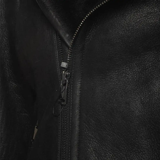Close-up of the distressed leather on Carter's biker bomber jacket zipper.