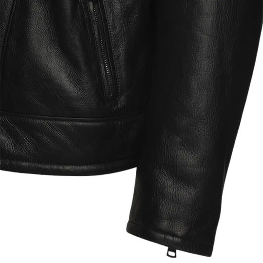 Detailed close-up of the waist belt hardware and pocket with cuffs on the Carters ginger brown biker shearling jacket, emphasizing the rugged style