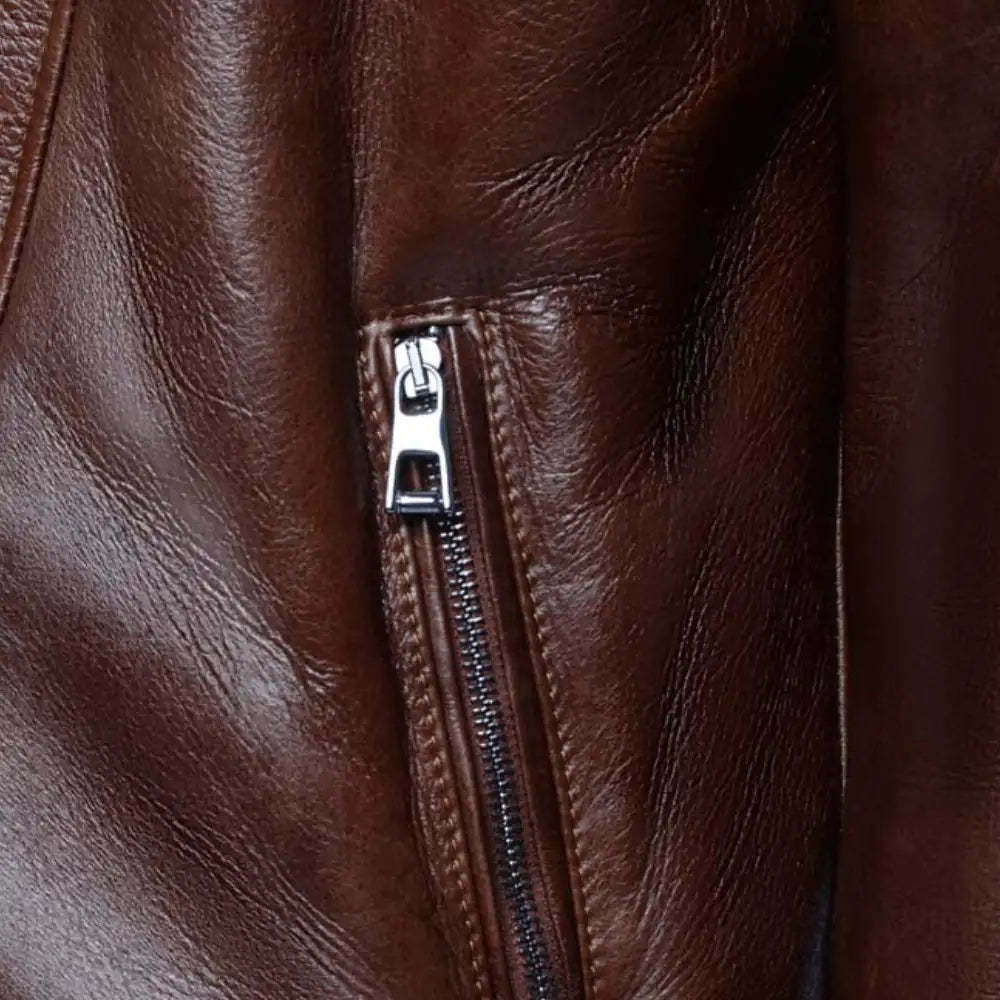 Detailed view of zippers and stitching on Carters Mateo leather biker jacket