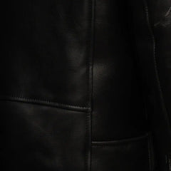 Closeup of zipper and buckle detail on Cater's Toscana Shearling Leather Biker Jacket
