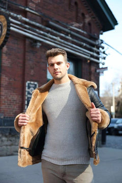 Man wearing Classic Ginger Brown B3 Bomber Aviator Shearling Jacket in an urban setting.