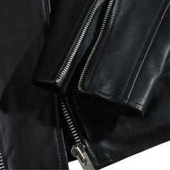 Close-up of the epaulette shoulder straps on the classic leather biker jacket, adding a bold military-inspired touch.