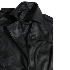 Close-up of a black leather coat lapels with buttons on a white background