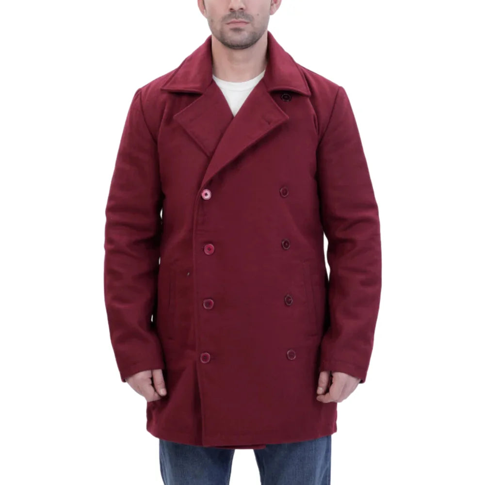 Man wearing a burgundy wool overcoat with closed buttons on a white background