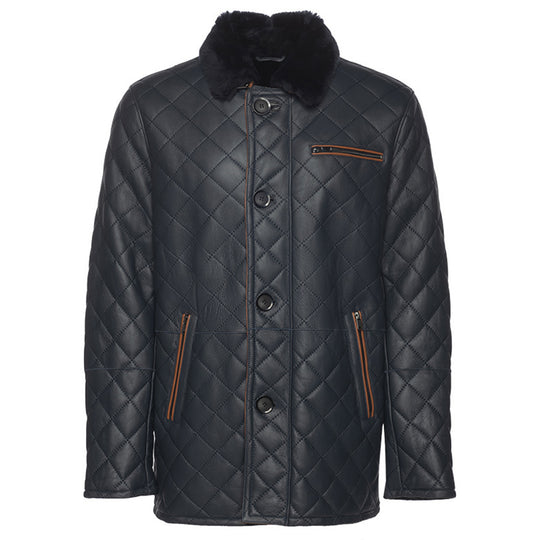 A navy quilted sheepskin shearling coat with a shirt style fur collar, buttoned up closure, and two functional outer pockets.