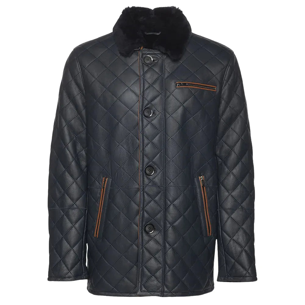 A navy quilted sheepskin shearling coat with a shirt style fur collar, buttoned up closure, and two functional outer pockets.