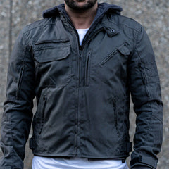 A model on a motorcycle wearing the grey hooded jacket, demonstrating the relaxed urban fit and the airflow functionality of the vents.