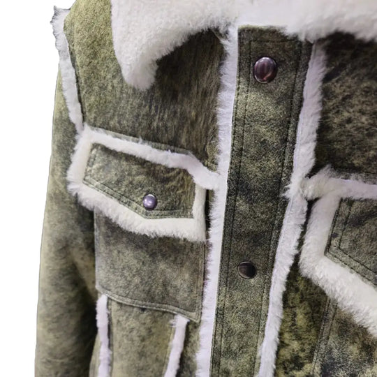 Close-up of Hudson's Green Trucker Shearling Jacket highlighting the flap pockets and shearling trim around the collar.