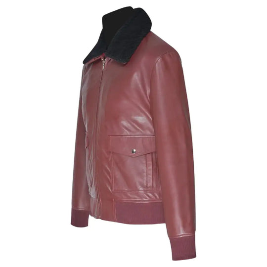 Side profile of Justin's Burgundy A2 Bomber leather jacket, highlighting its sleek design with ribbed knit cuffs and a shirt-style collar.