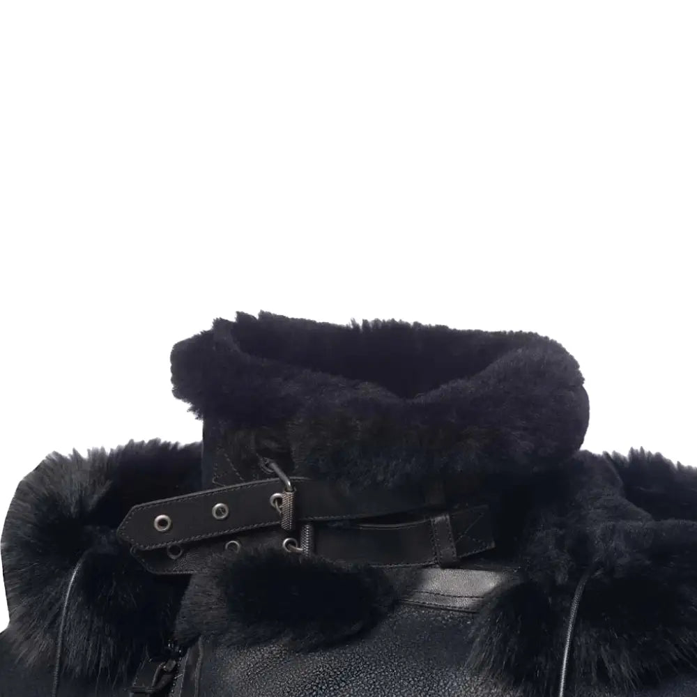 Black shearling coat with fur collar and belt on a white background