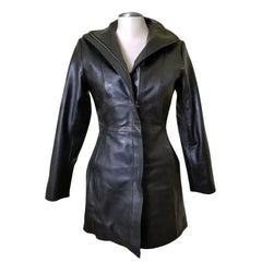 Front view of Nelly's women's long leather coat on a mannequin, featuring double wind flaps and a button-down closure.