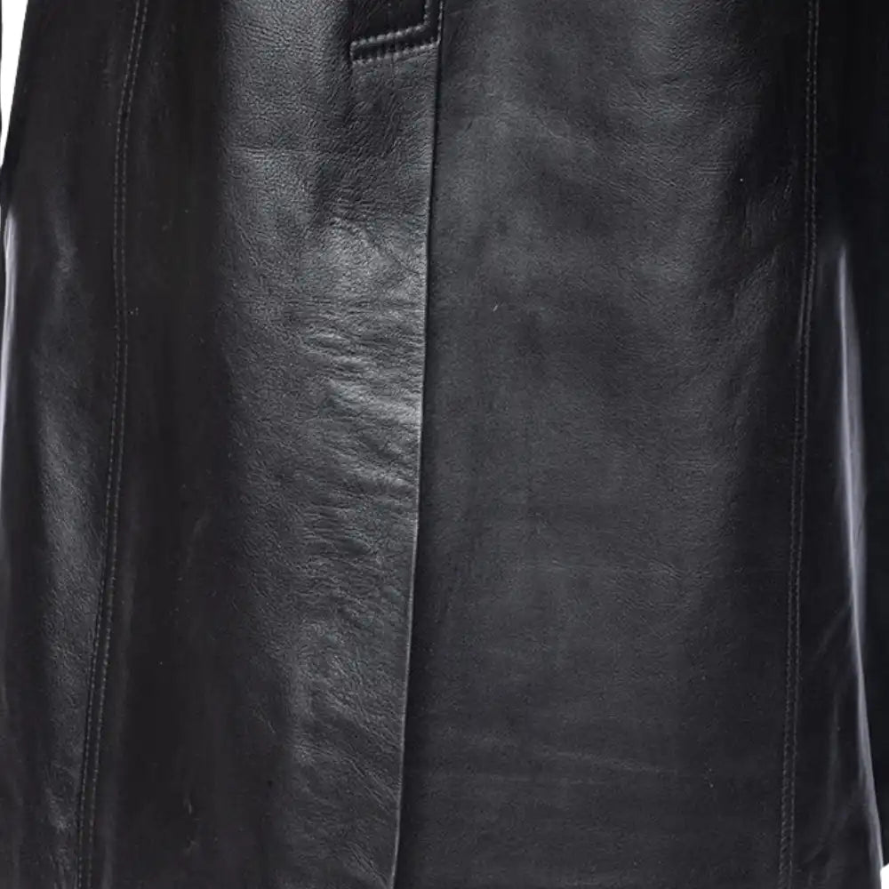Close-up of a black leather jacket with visible texture and stitching.