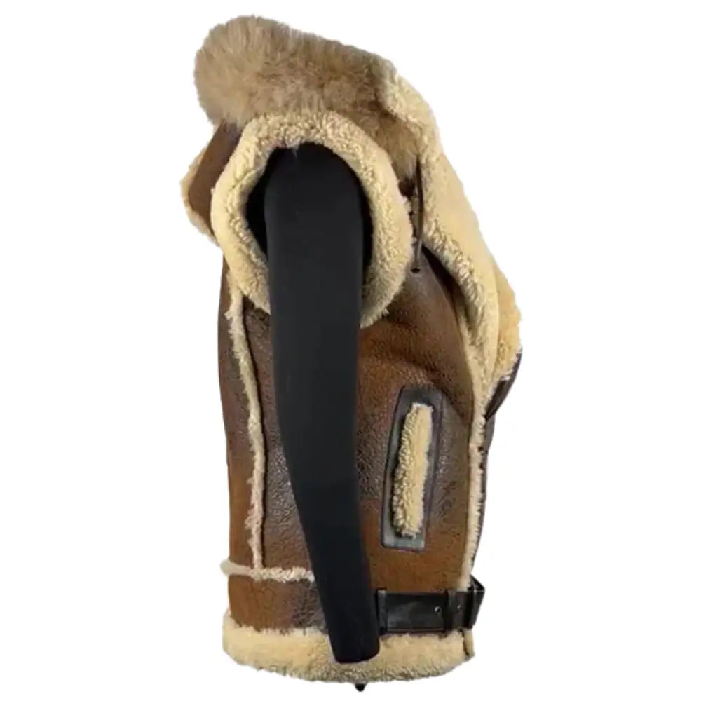 Side view of Ridgeway's Vintage Brown Shearling Vest showcasing the distressed leather exterior and white shearling trim. The vest features a sleek black buckle and leather straps, with a rustic, timeless look.
