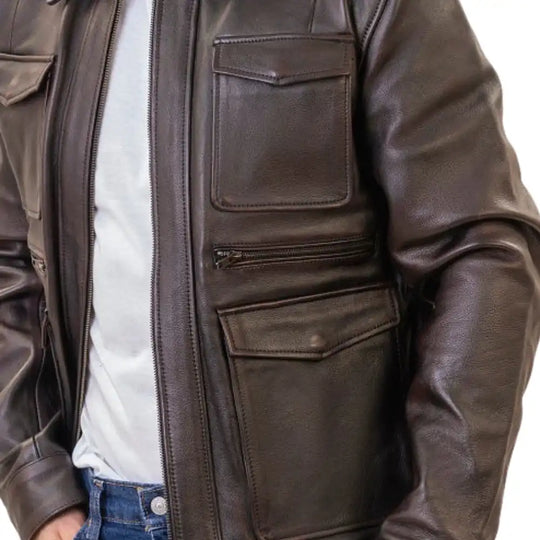 A model on a custom scrambler wearing the River jacket, showcasing its rugged aesthetic and timeless, vintage-inspired silhouette.