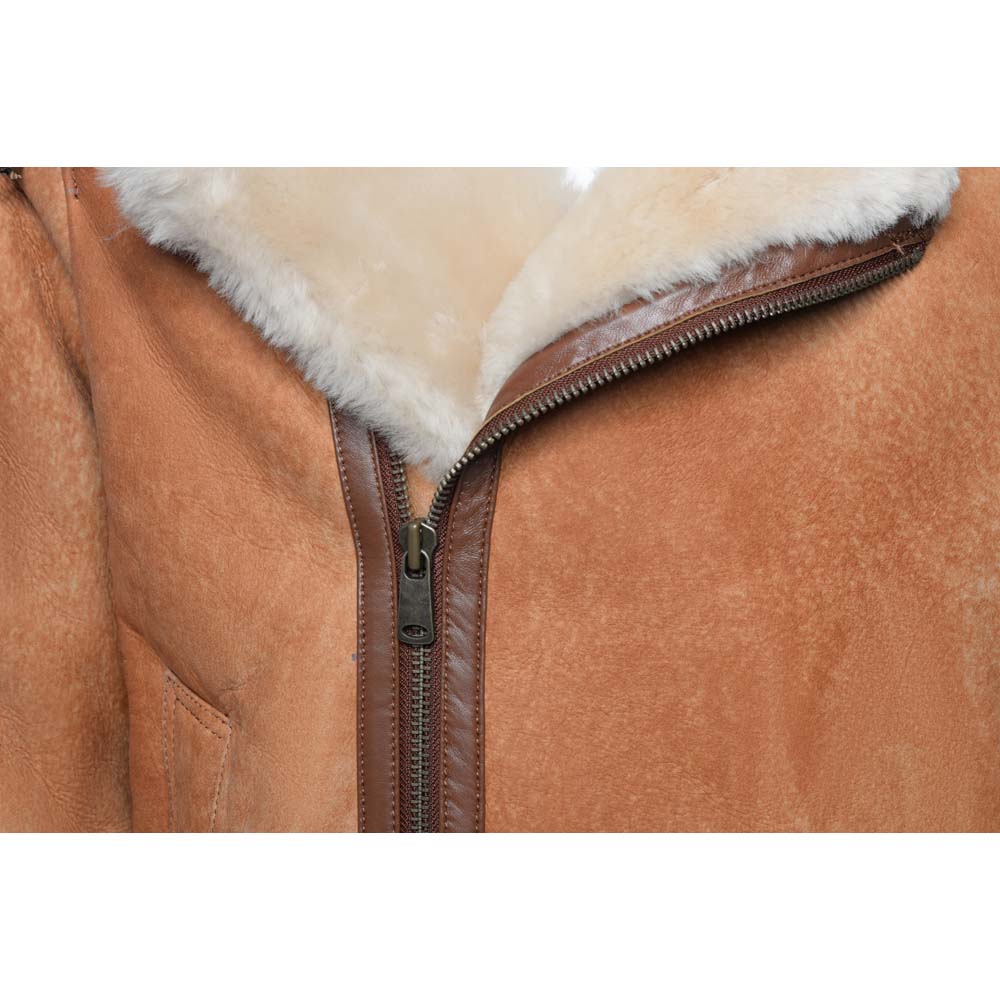 Close-up of a Cognac shearling aviator jacket leather jacket with fur lining and zipper.