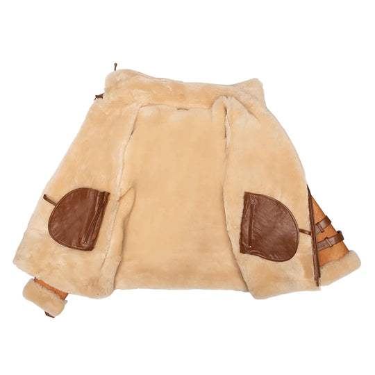 Close-up of the thick cream shearling interior lining and internal leather pockets of the Rocco vintage cognac jacket.