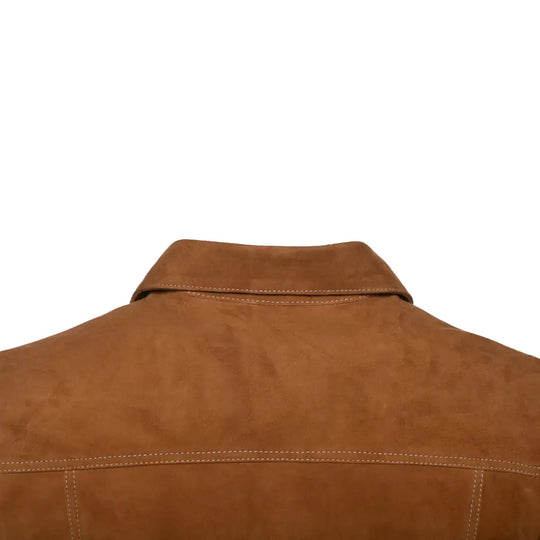 Close-up of collar for a tan suede leather shirt on a white background