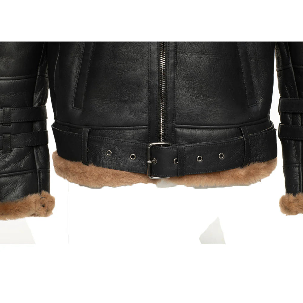 Close-up of waist belt of black aviator jacket with brown fur trim on a white background