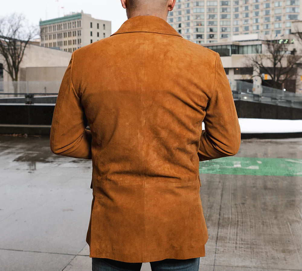 Rear view of a Man wearing Wyatt tan suede leather blazer in an urban setting.