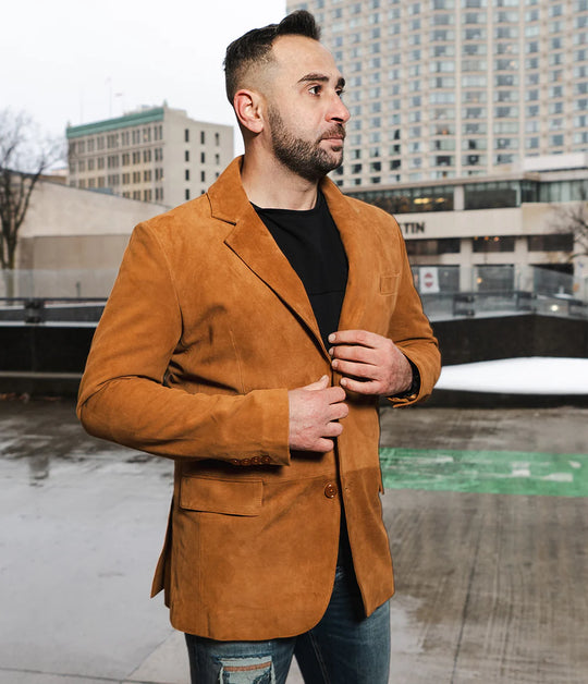 Man wearing Wyatt tan suede leather blazer in an urban setting.
